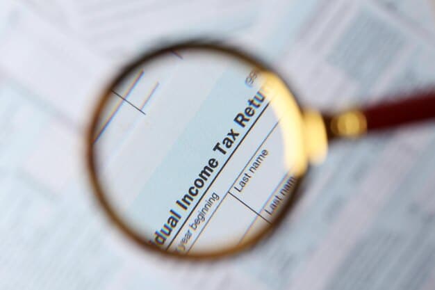 A close-up of a U.S. tax form highlighting the section for the Earned Income Tax Credit (EITC) with a magnifying glass hovering over it.