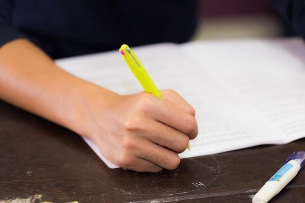 Hands signing a document with the words 