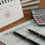 2025 Tax Law Changes: Maximize Deductions Before April 15th Tax forms, calculator, and calendar with April 15th circled, symbolizing tax preparation.