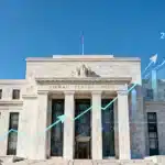 Federal Reserve's 2026 Interest Rate Outlook: Two Hikes Projected Federal Reserve building with financial charts and arrows, symbolizing 2026 interest rate projections.
