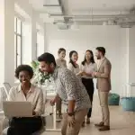 Employee Benefits Trends 2026: Beyond Traditional Packages Diverse employees engaging positively in a modern office, showcasing future employee benefits trends.